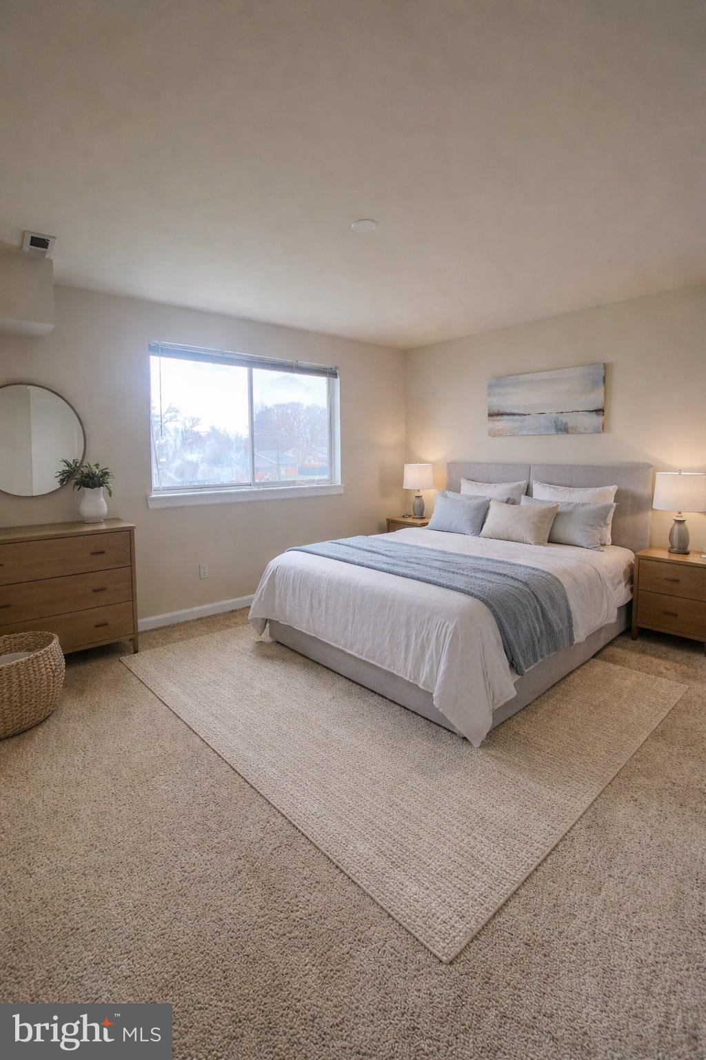 7514 Hawthorne Street, Unit 5 Landover, MD 20785 - Photo 9 of 16 a spacious bedroom with a bed and window