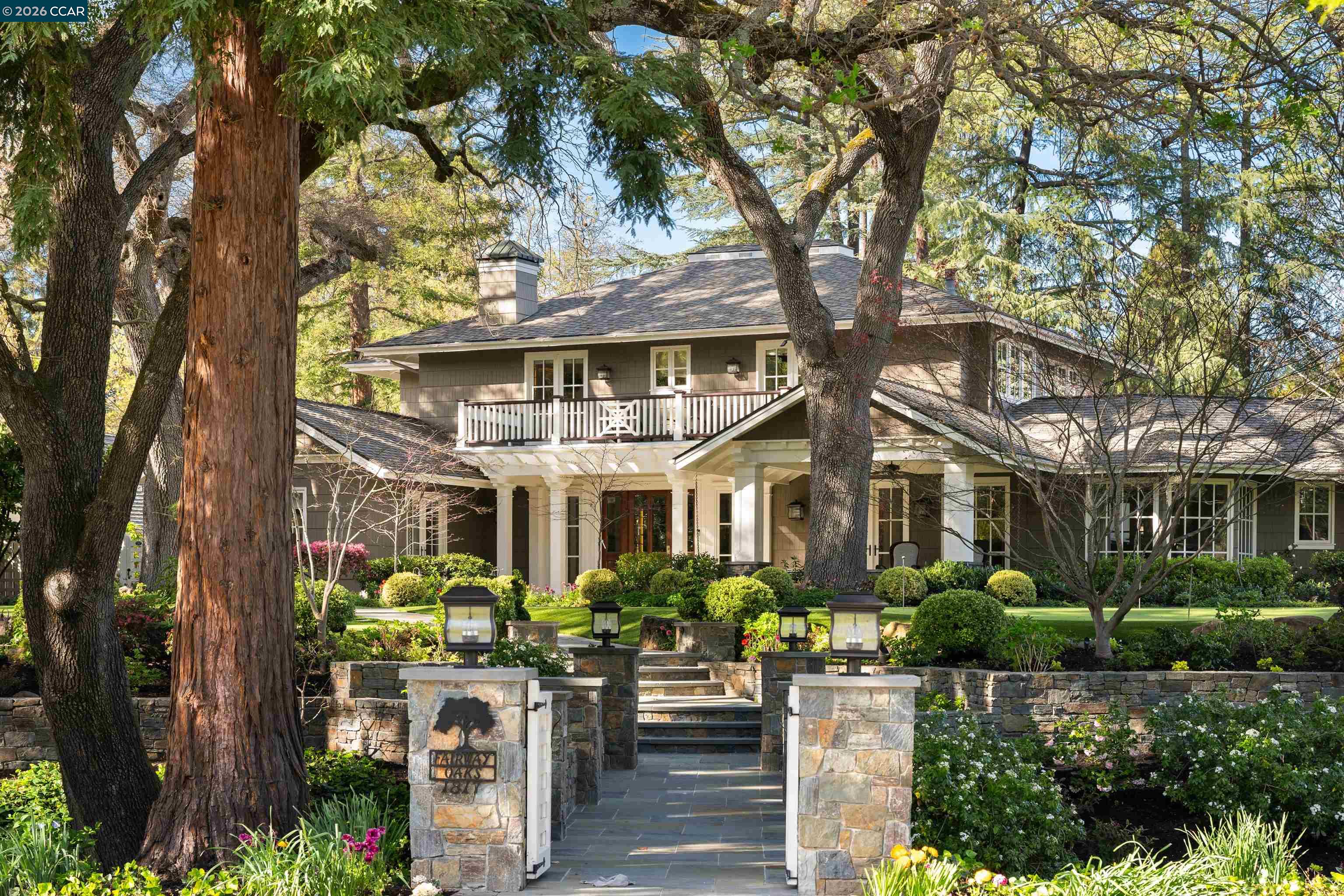 a front view of a house with a garden