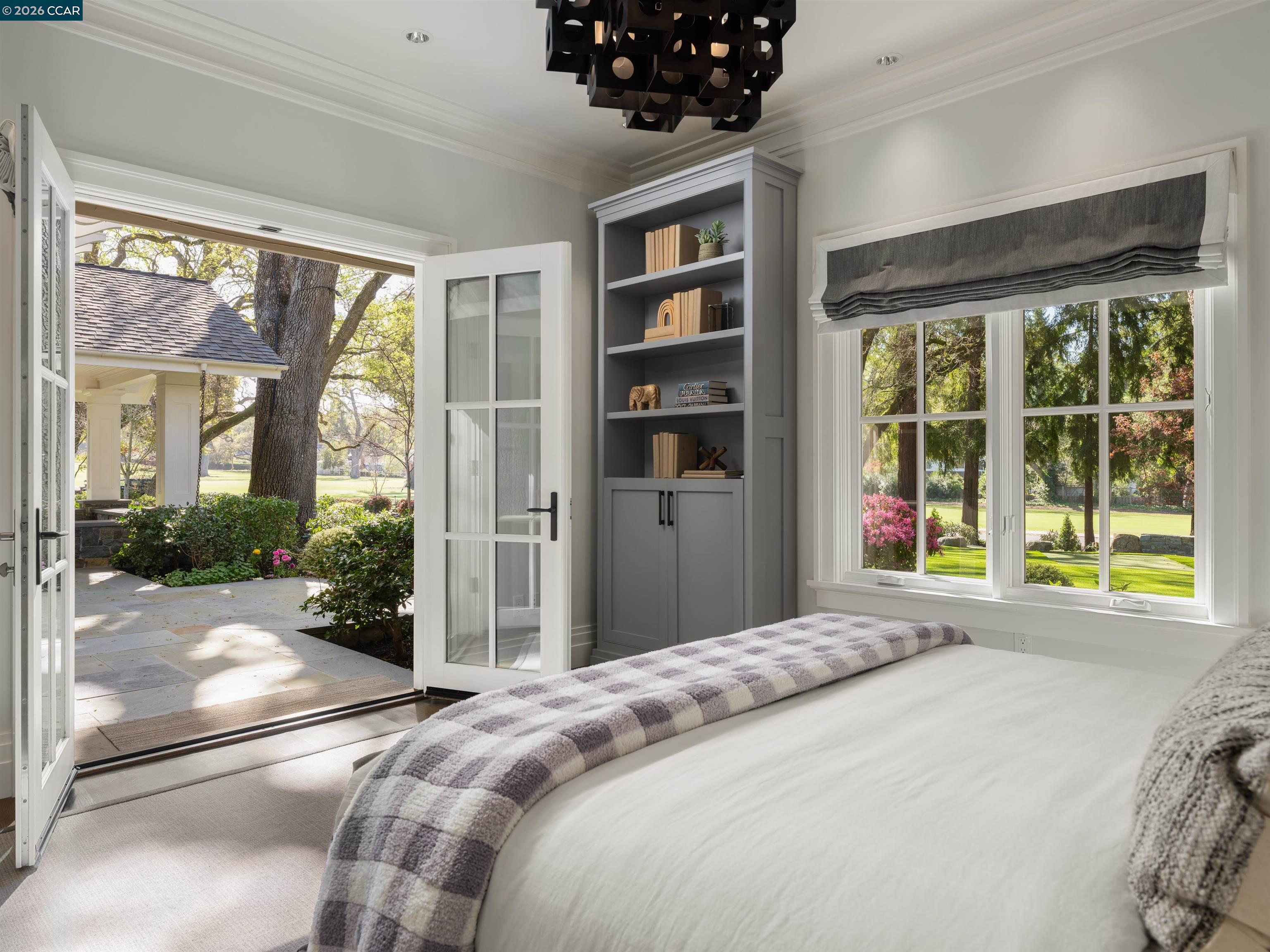 Diablo Diablo, CA 94528 - Photo 23 of 41 a bedroom with a bed and a large window with outer view