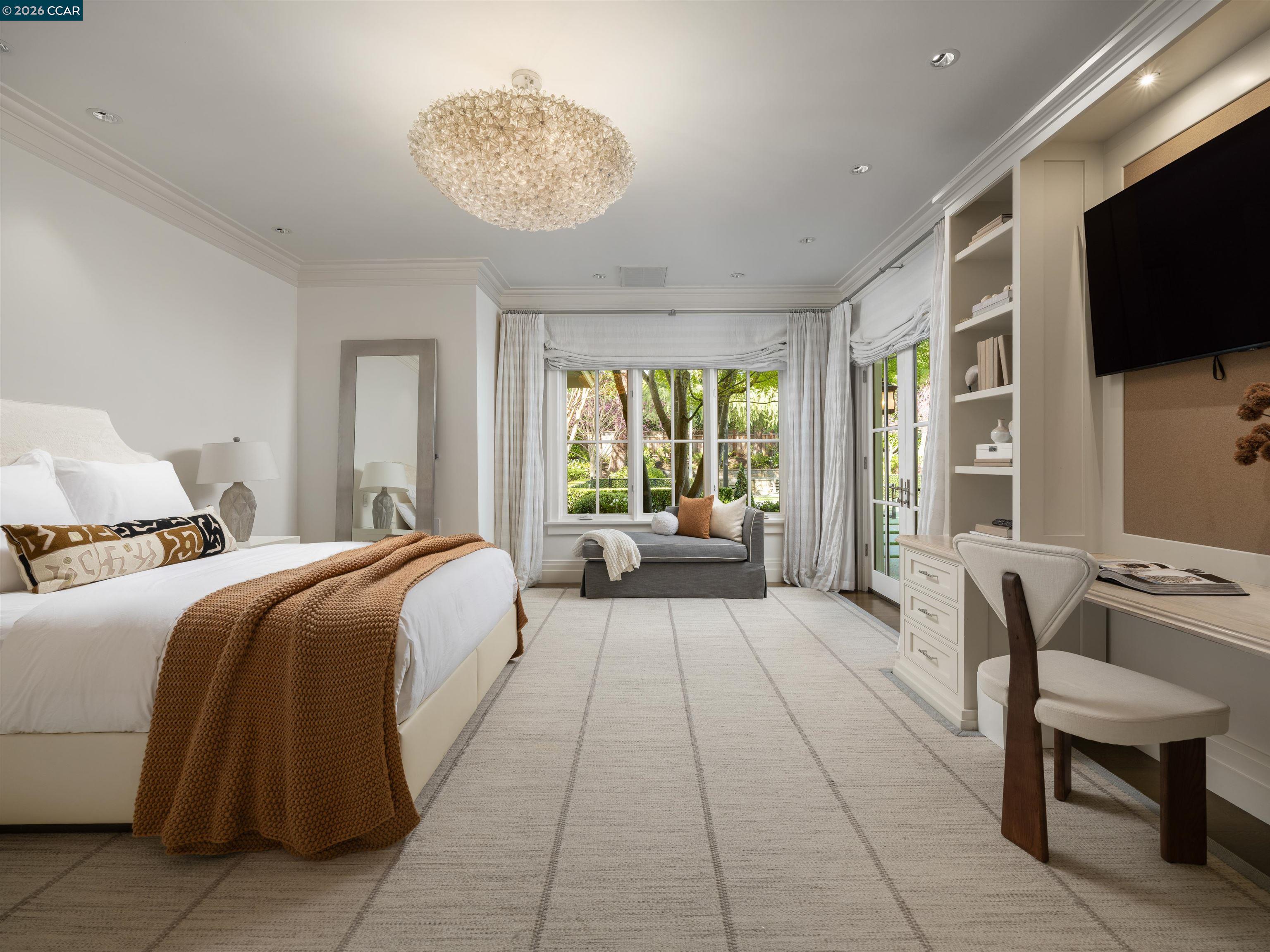 Diablo Diablo, CA 94528 - Photo 24 of 41 a bedroom with a bed and a flat screen tv