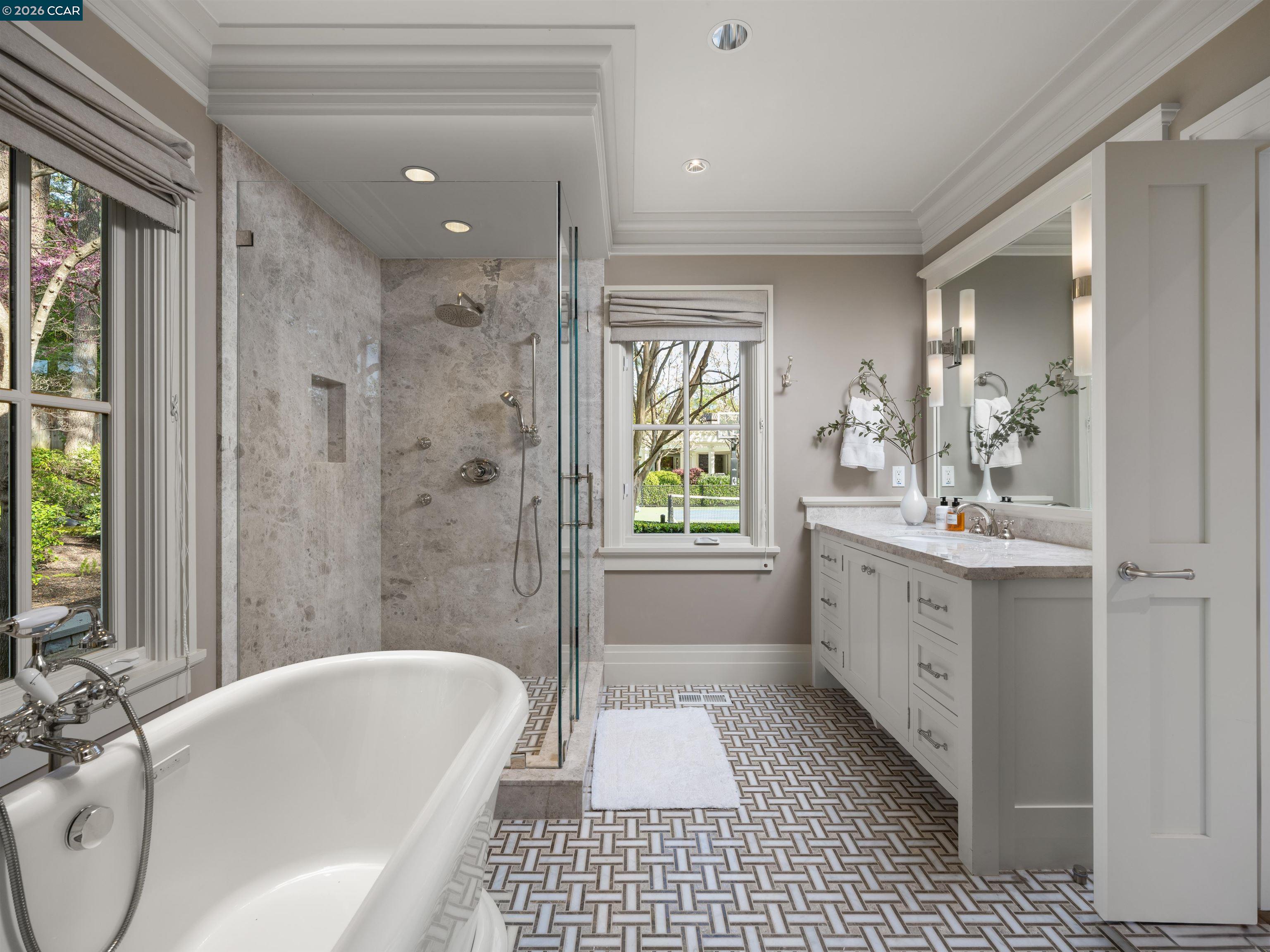 Diablo Diablo, CA 94528 - Photo 29 of 41 a bathroom with a tub a sink a mirror and a shower