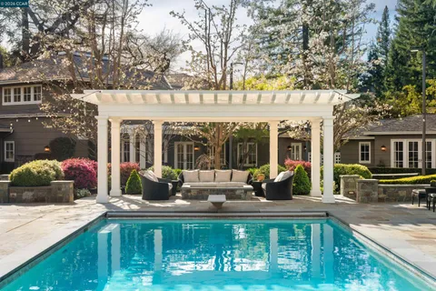 a front view of house with yard outdoor seating and barbeque oven
