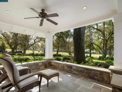 a living room with hardwood floor and a large window