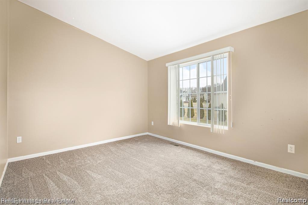 263 Wood Point, Unit 24 Howell, MI 48843 - Photo 6 of 15 A spacious bedroom awaits you!
