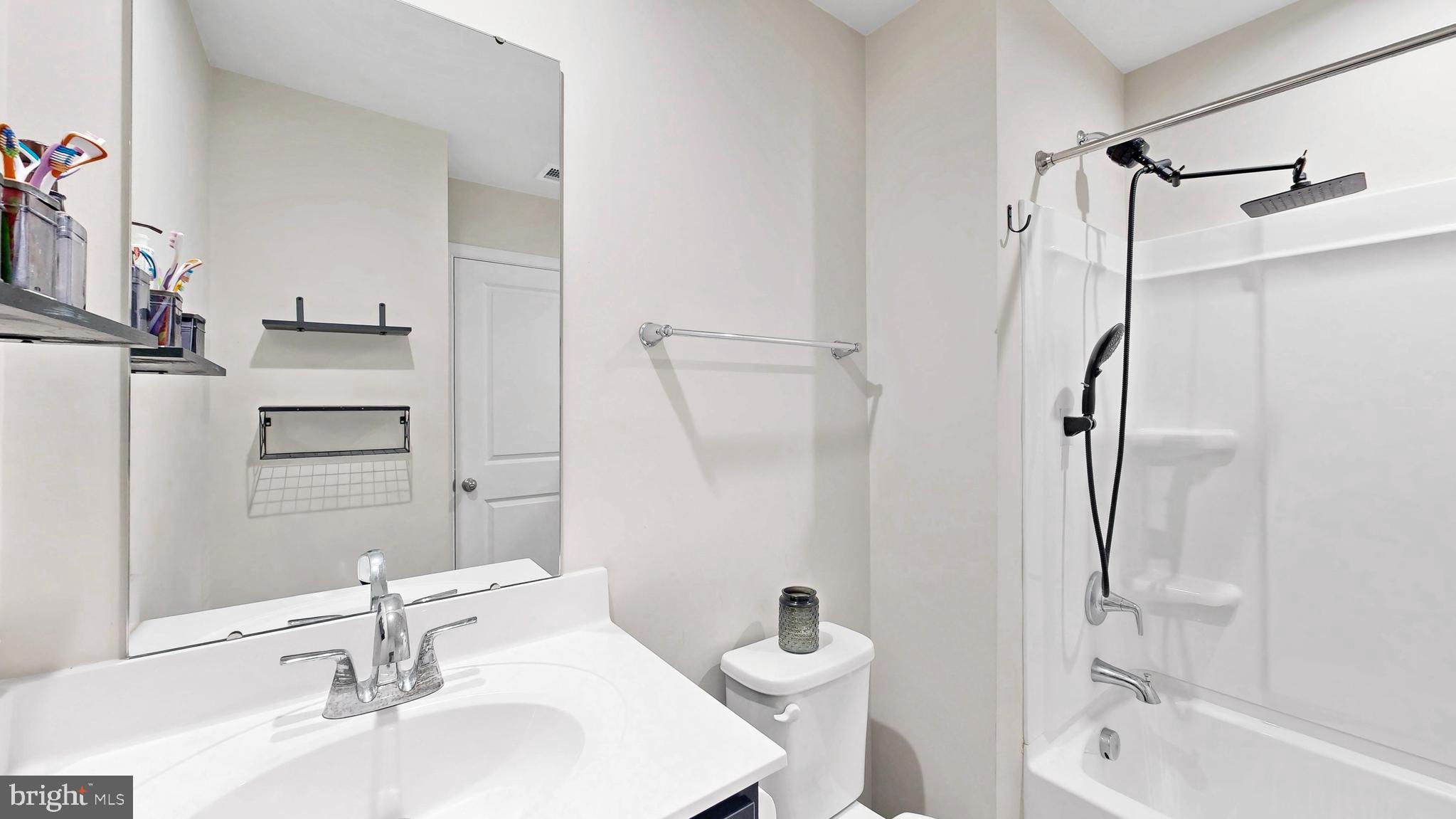 385 Galena Road Frederica, DE 19946 - Photo 10 of 41 a bathroom with a sink toilet and shower