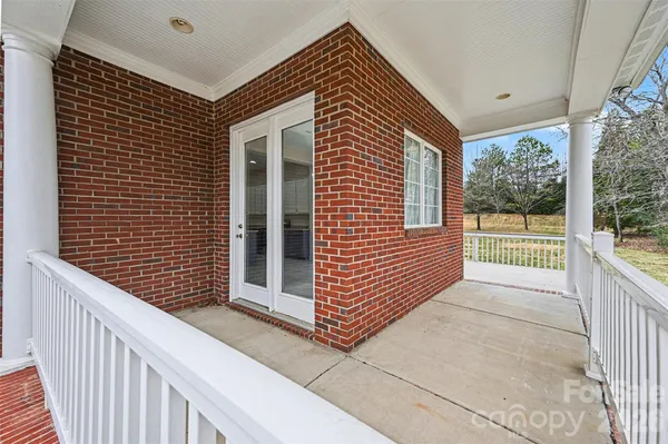 a view of a house with porch and wooden floor