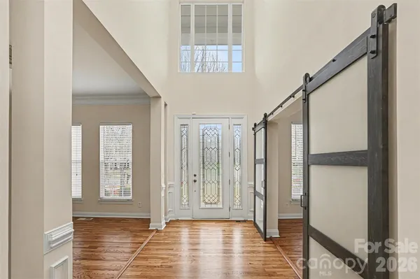 a view of entryway with wooden floor and stair