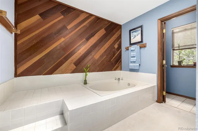 a bathroom with a bathtub and a shower