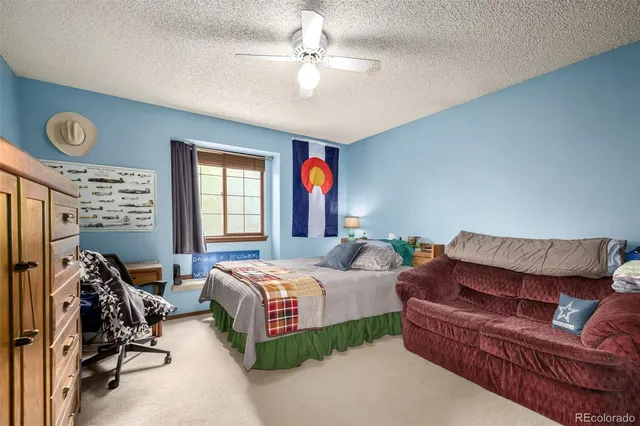 a bedroom with bed and window