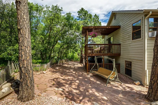 a view of balcony with wooden floor and outdoor seating