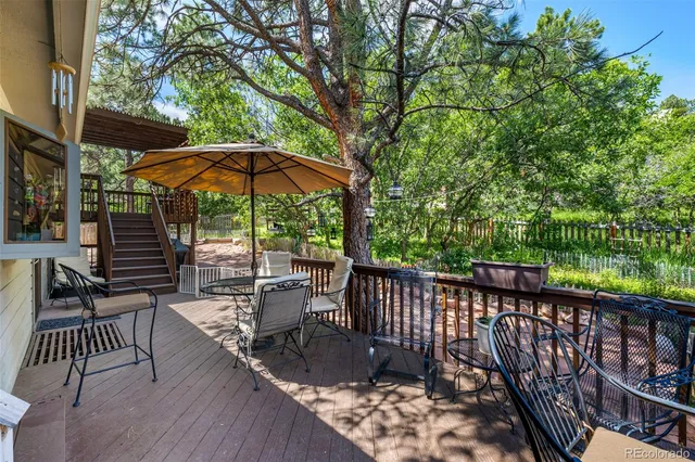a view of a two chairs in the balcony