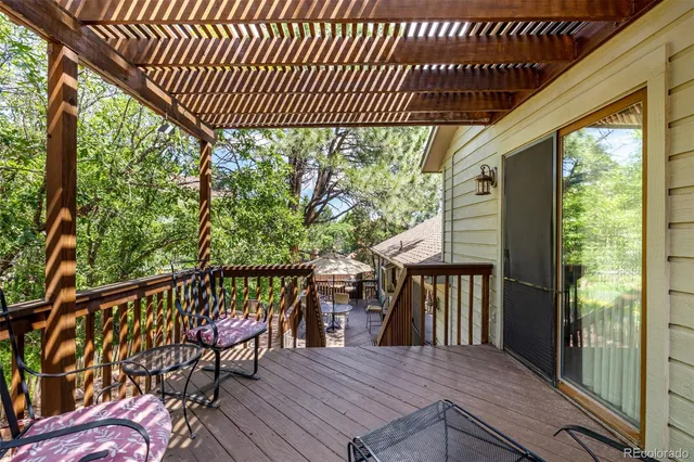 a view of a two chairs in the balcony