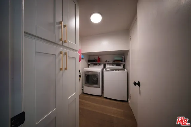 a view of a storage & utility room with washer and dryer