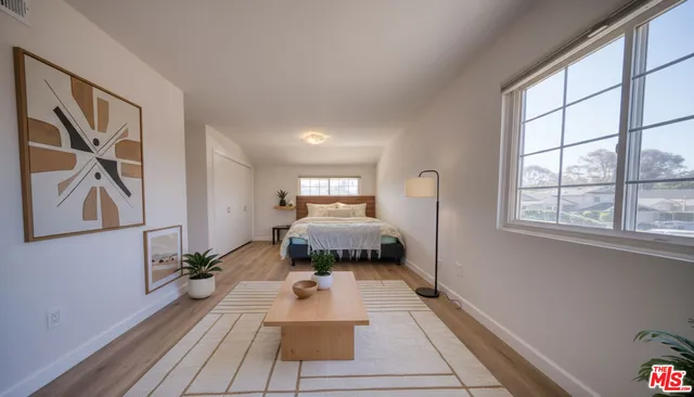 a bed room with a bed and a window