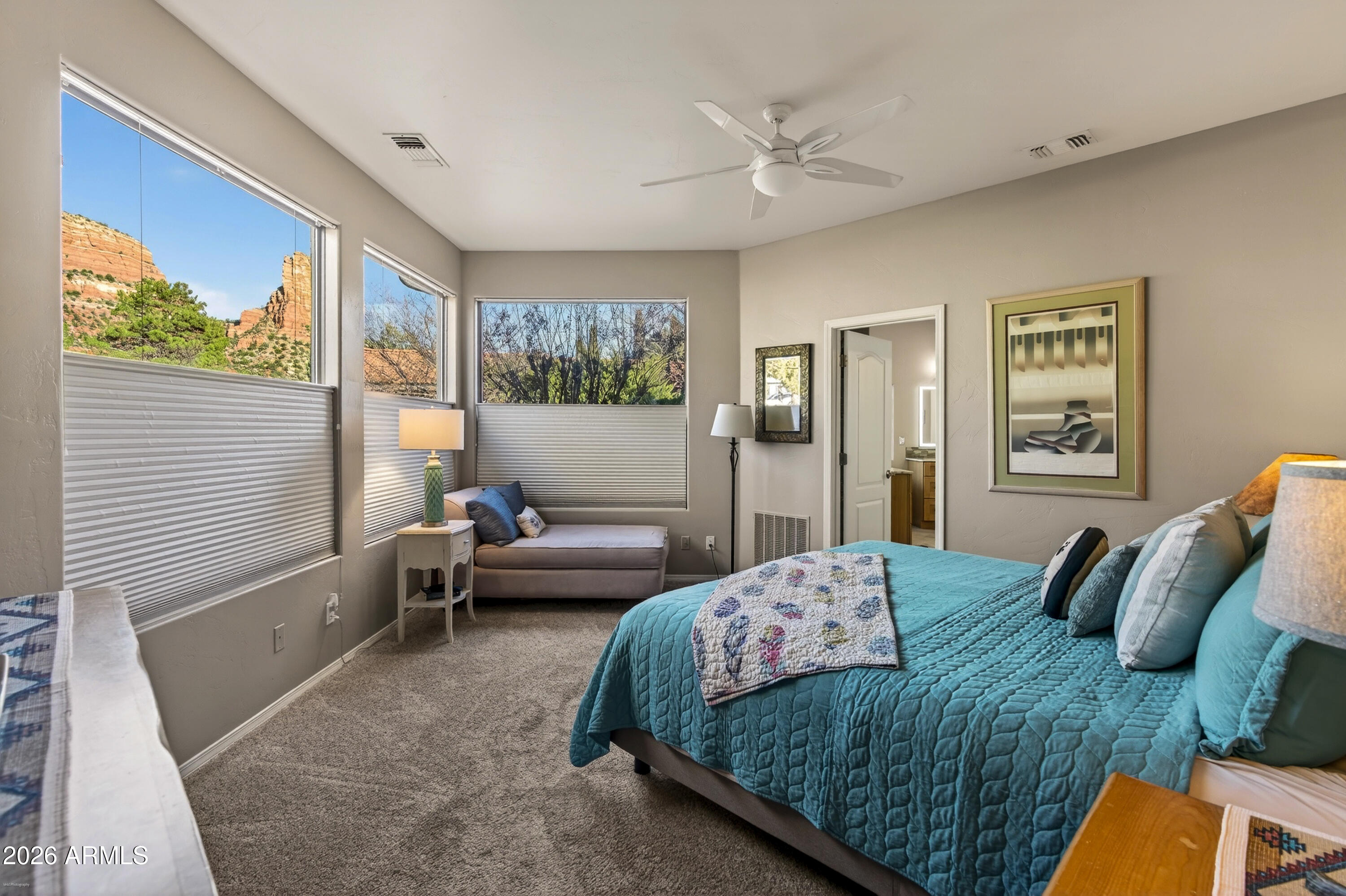 345 Merry Go Round Rock Road Sedona, AZ 86351 - Photo 15 of 43 a bedroom with a bed and wooden floor