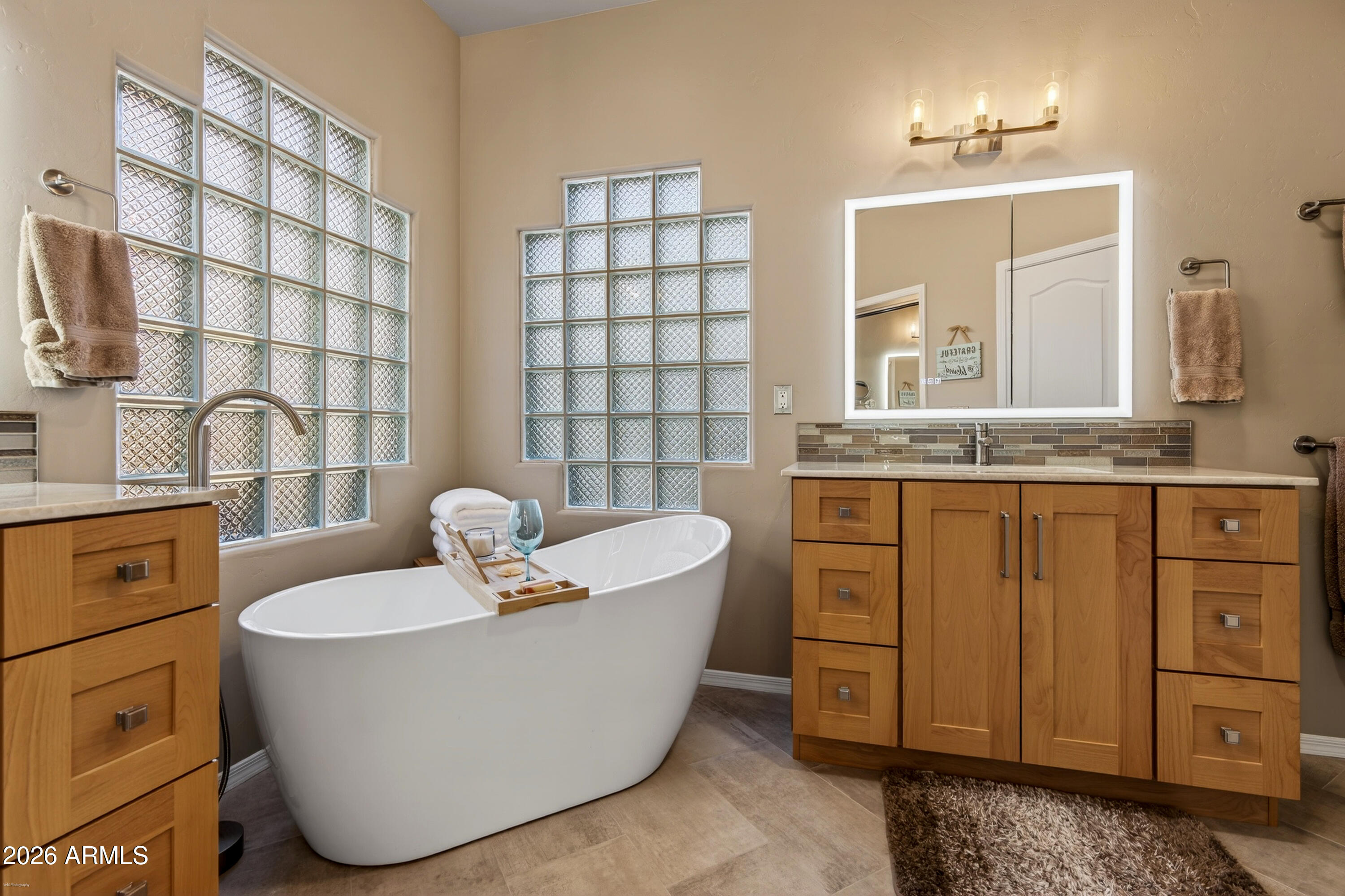 345 Merry Go Round Rock Road Sedona, AZ 86351 - Photo 18 of 43 a bathroom with a tub sink and mirror