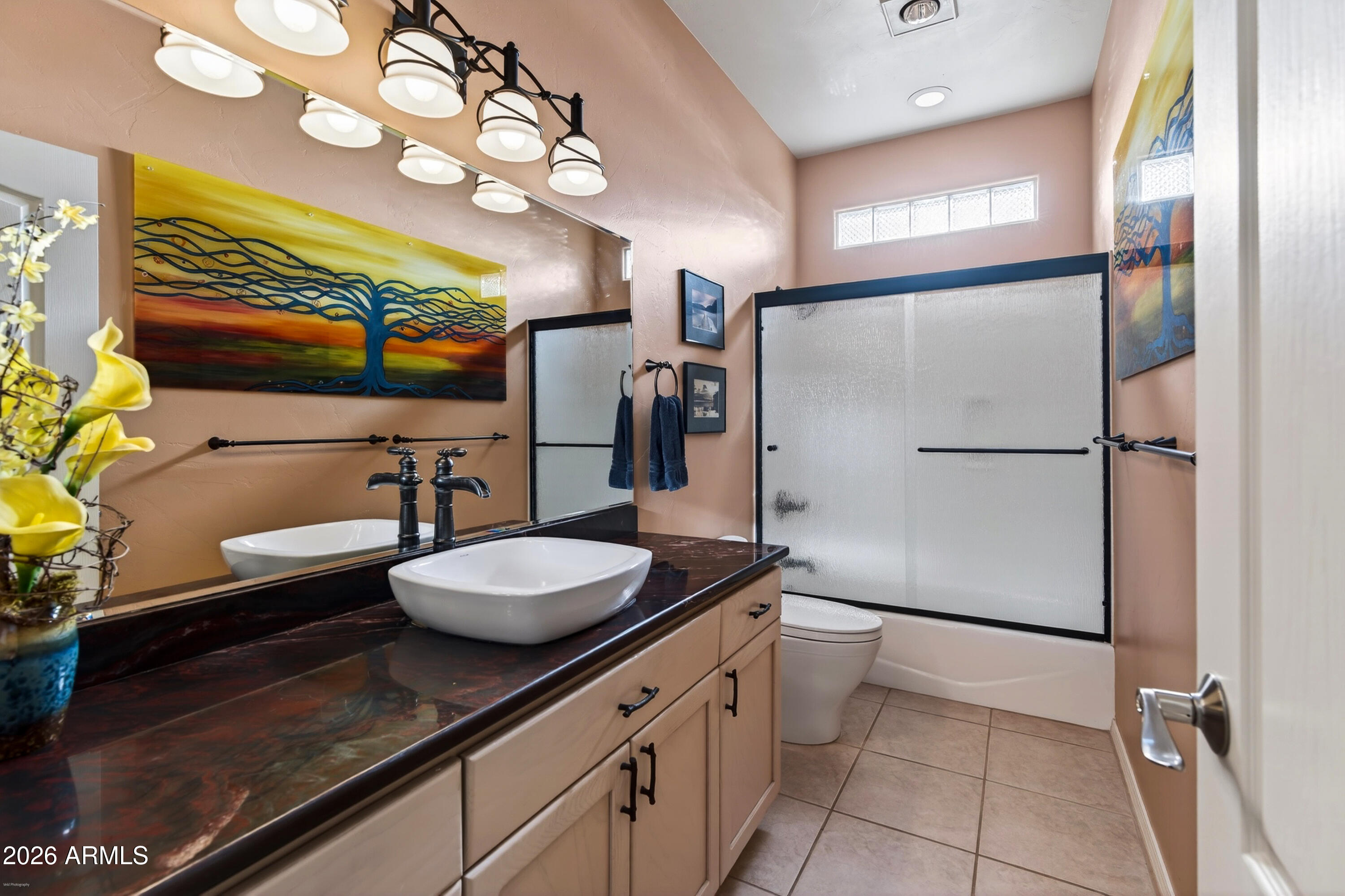345 Merry Go Round Rock Road Sedona, AZ 86351 - Photo 22 of 43 a bathroom with a granite countertop sink a toilet a mirror and shower