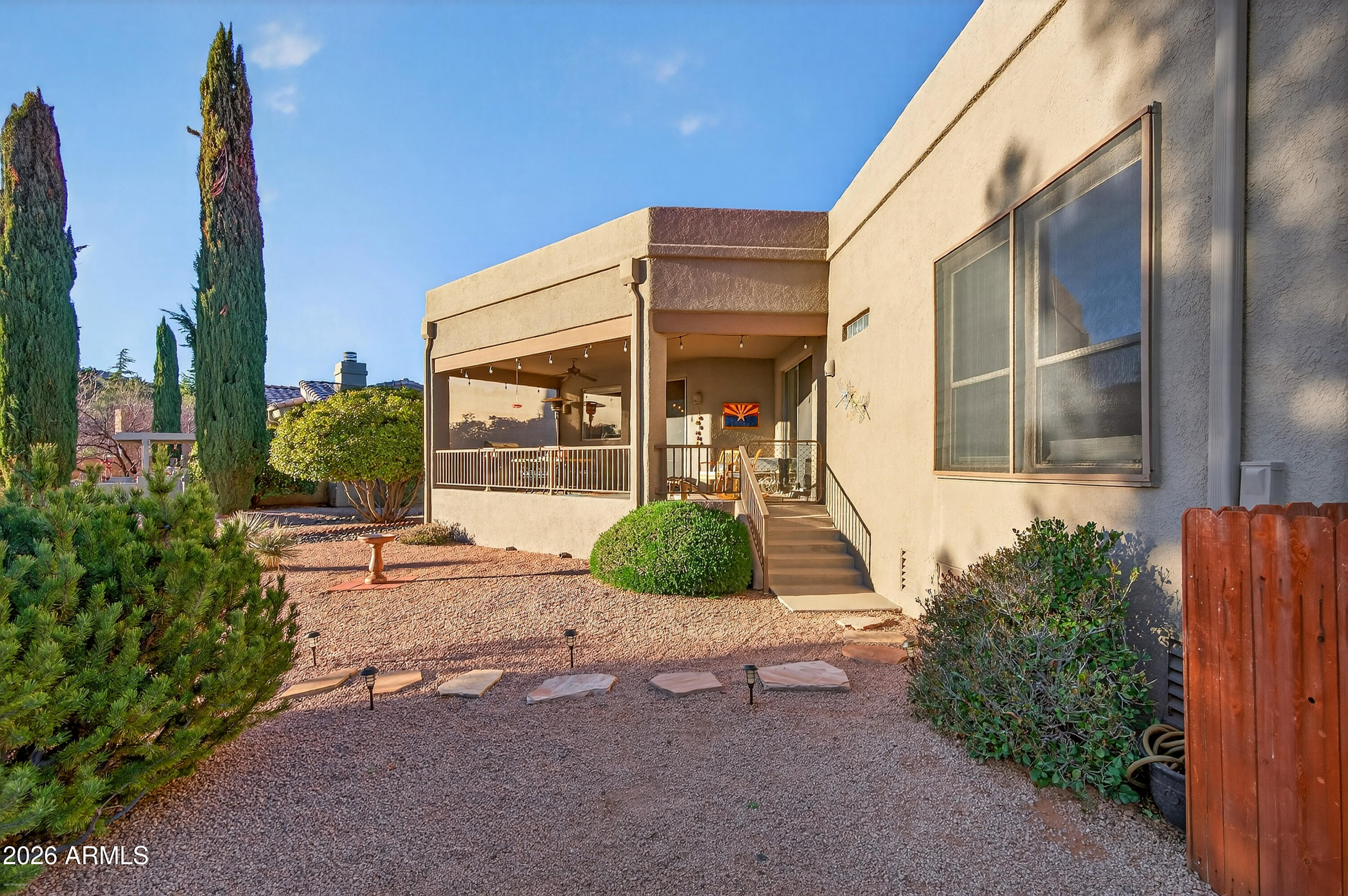 345 Merry Go Round Rock Road Sedona, AZ 86351 - Photo 27 of 43 a front view of a house with garden