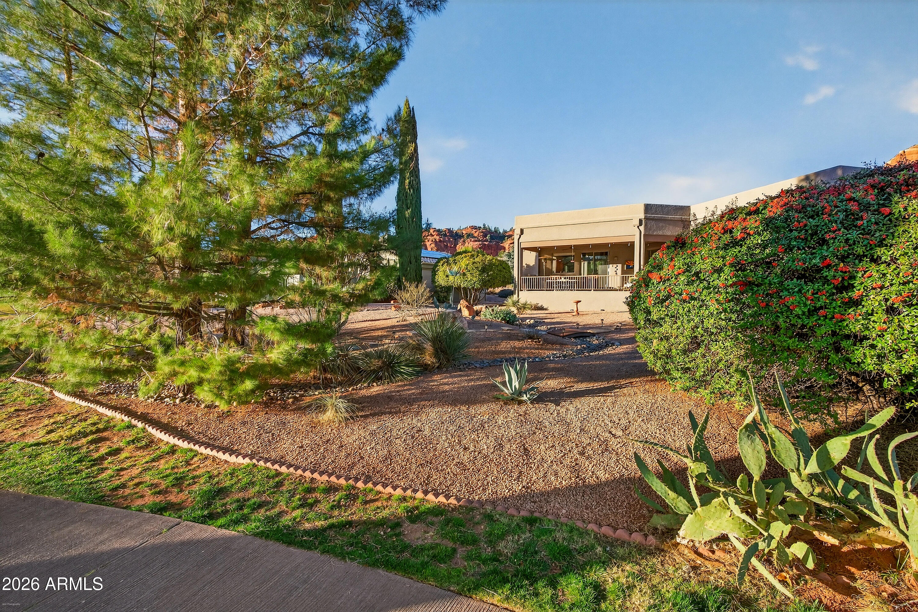 345 Merry Go Round Rock Road Sedona, AZ 86351 - Photo 29 of 43 a front view of a house with a yard