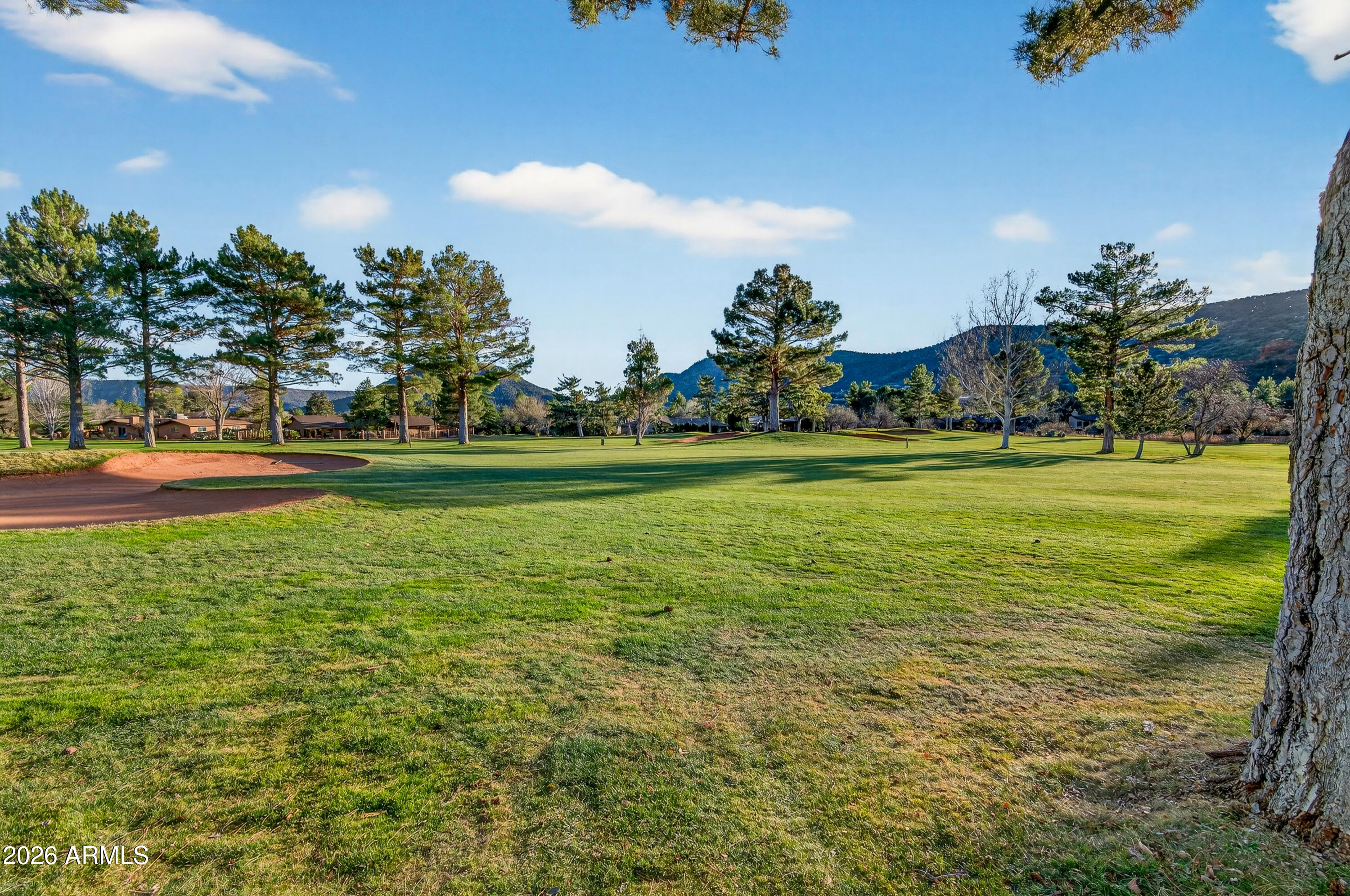 345 Merry Go Round Rock Road Sedona, AZ 86351 - Photo 33 of 43 a view of a patio with a big yard