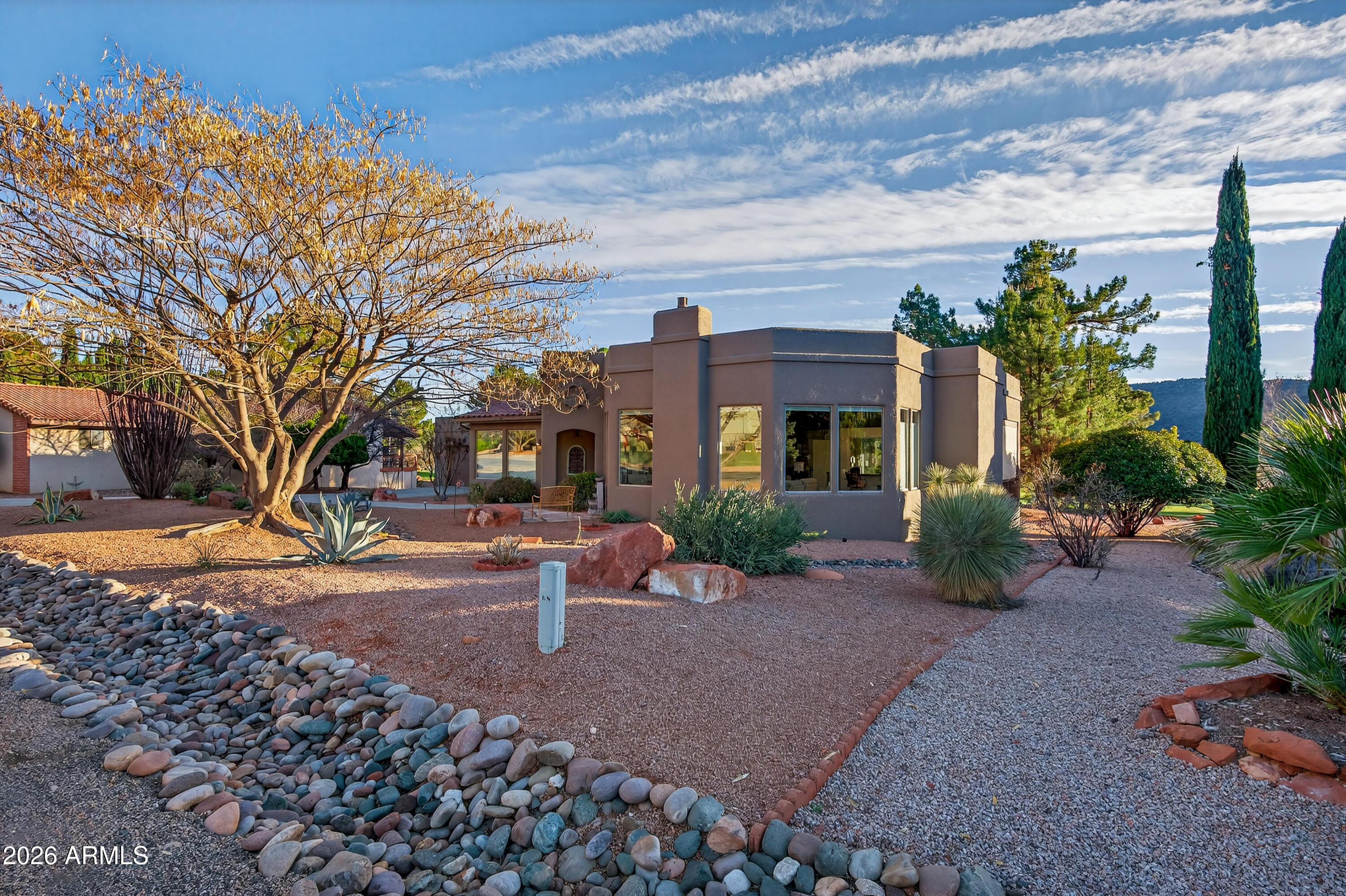 345 Merry Go Round Rock Road Sedona, AZ 86351 - Photo 36 of 43 a view of a house with backyard porch and sitting area