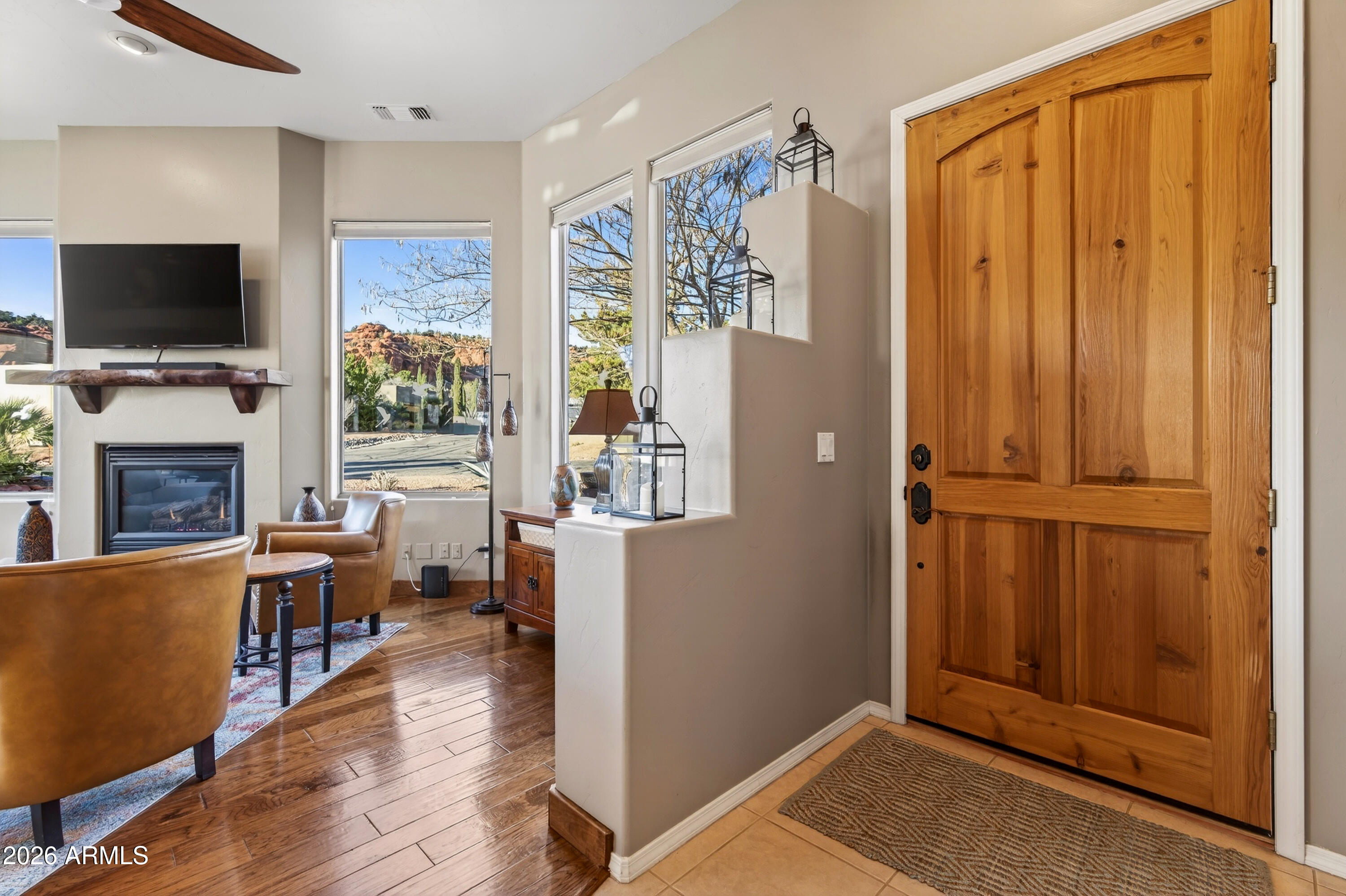 345 Merry Go Round Rock Road Sedona, AZ 86351 - Photo 4 of 43 a view of a livingroom with furniture and a flat screen tv