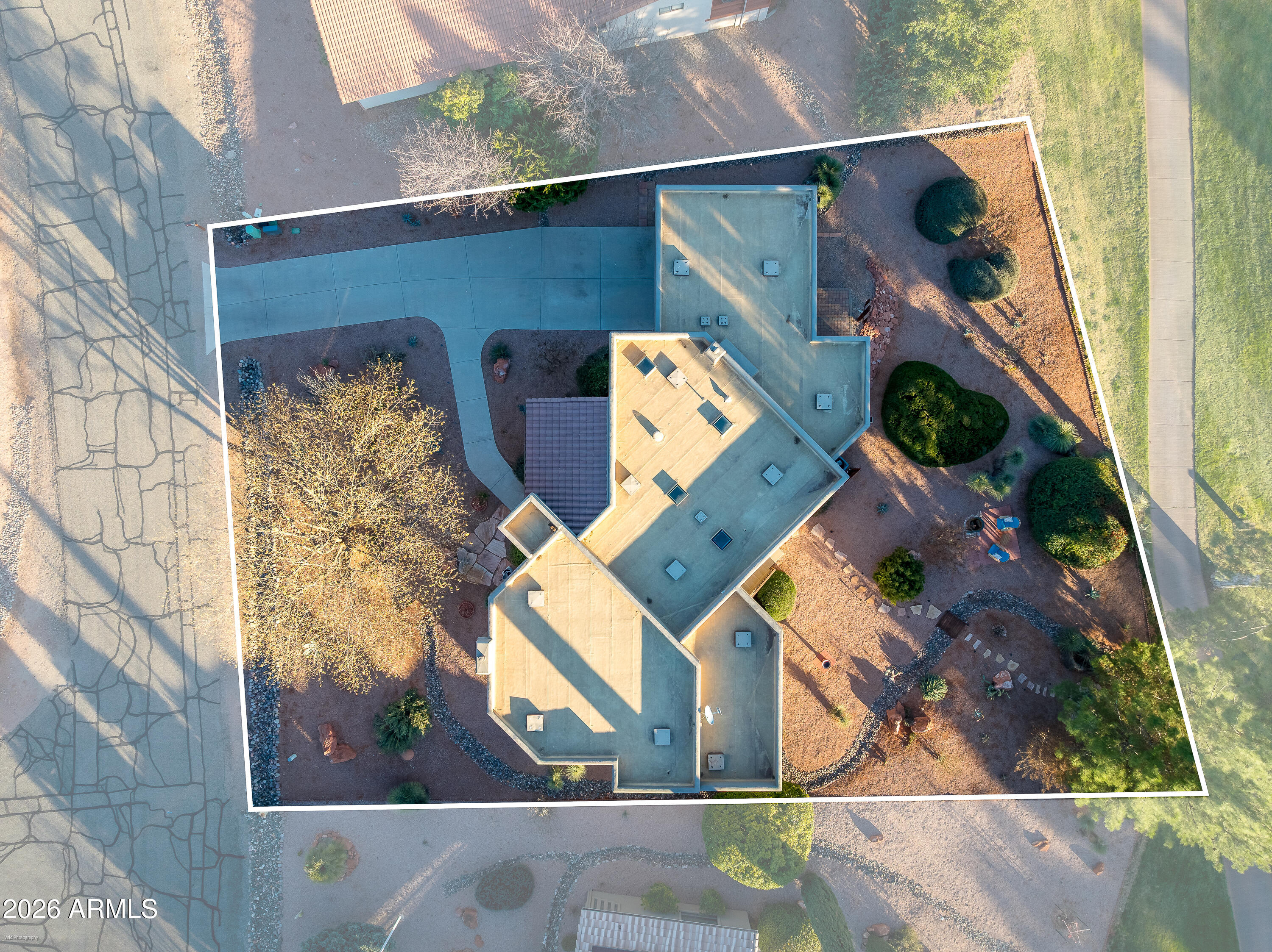 345 Merry Go Round Rock Road Sedona, AZ 86351 - Photo 42 of 43 an aerial view of a house with a garden