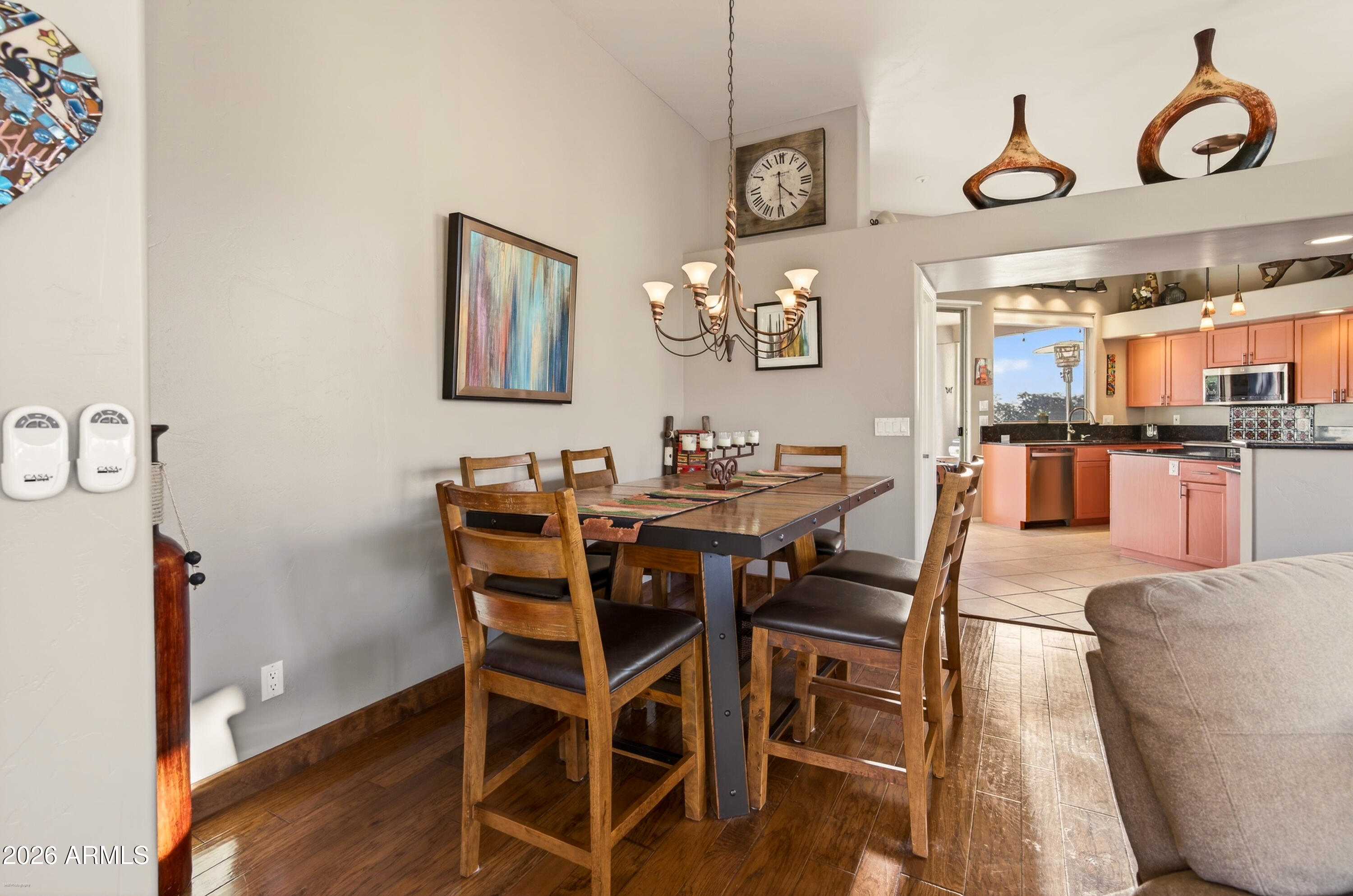 345 Merry Go Round Rock Road Sedona, AZ 86351 - Photo 7 of 43 a view of a dining room with furniture and wooden floor