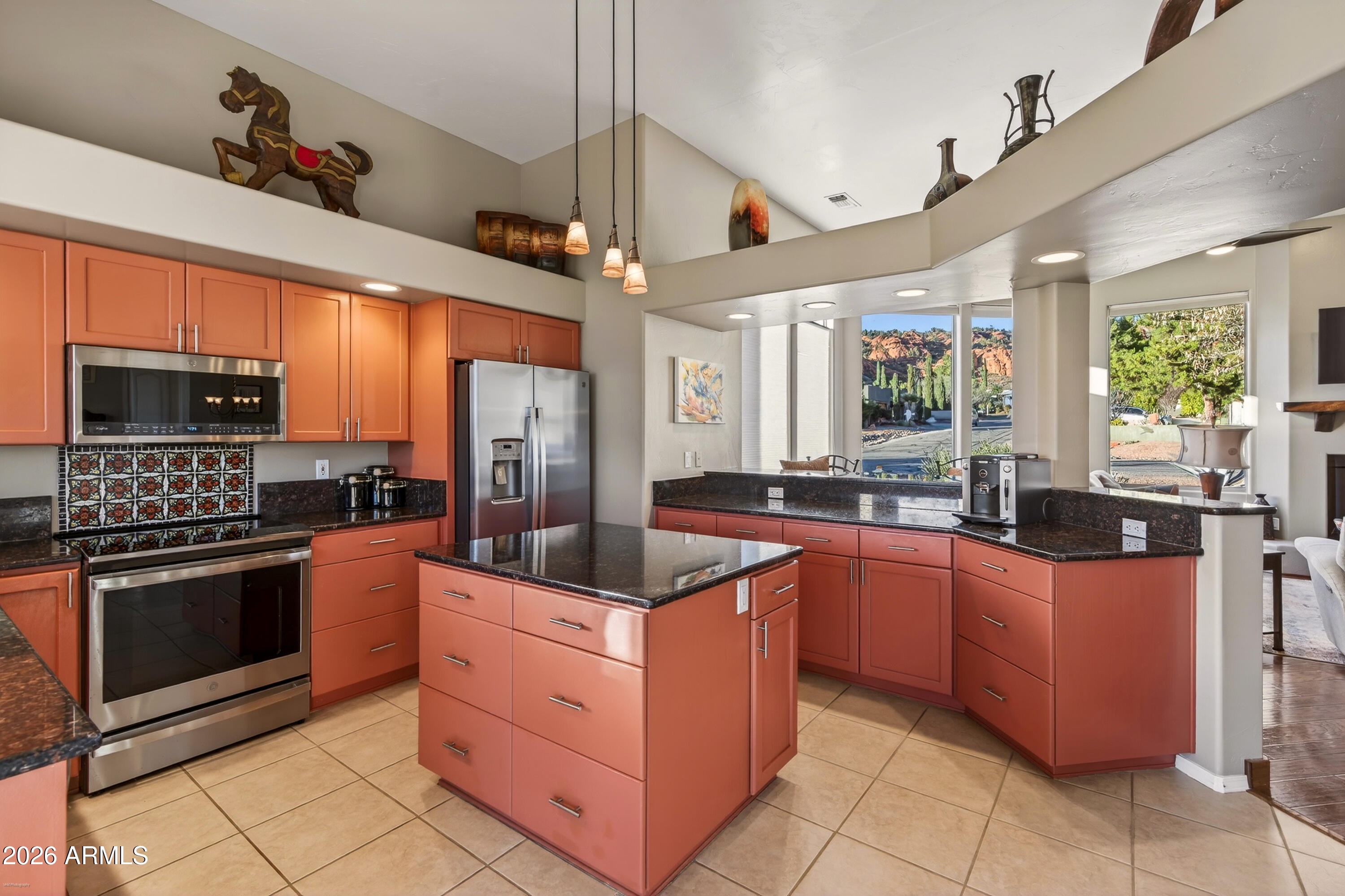 345 Merry Go Round Rock Road Sedona, AZ 86351 - Photo 10 of 43 a kitchen with stainless steel appliances granite countertop a stove oven and a refrigerator