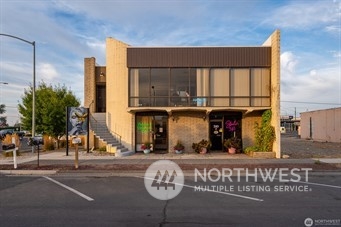 310 South Balsam Street Moses Lake, WA 98837 - Photo 1 of 10 a front view of a building with parking