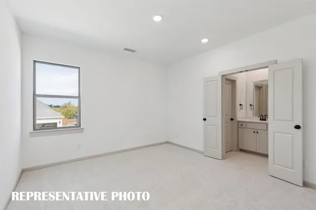a view of an empty room and a window