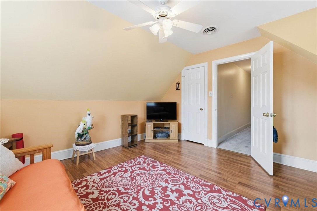 14110 Howlett Line Drive Colonial Heights, VA 23834 - Photo 27 of 44 a living room with furniture and a wooden floor