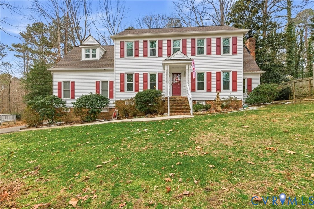 14110 Howlett Line Drive Colonial Heights, VA 23834 - Photo 3 of 44 a view of a brick building next to a yard