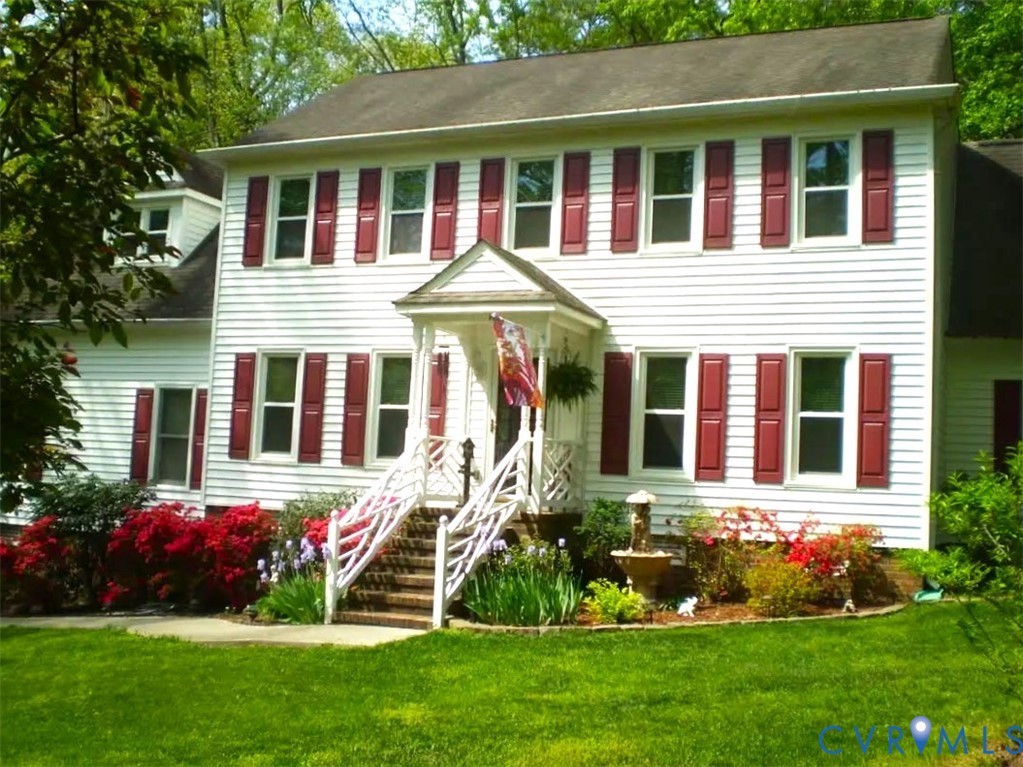 14110 Howlett Line Drive Colonial Heights, VA 23834 - Photo 41 of 44 a front view of a house with a yard and potted plants