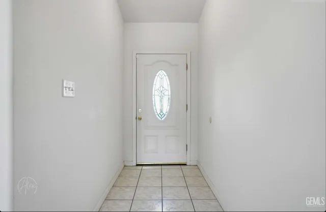 a view of a livingroom with wooden floor and a window