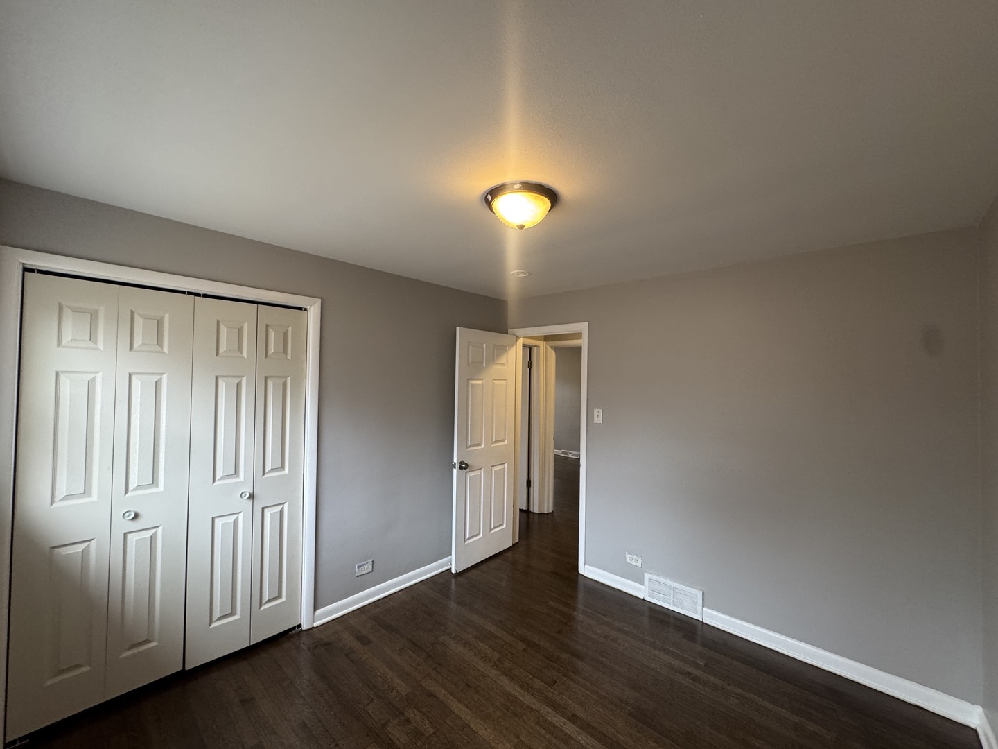 15125 East End Avenue Dolton, IL 60419 - Photo 13 of 21 an empty room with wooden floor and windows
