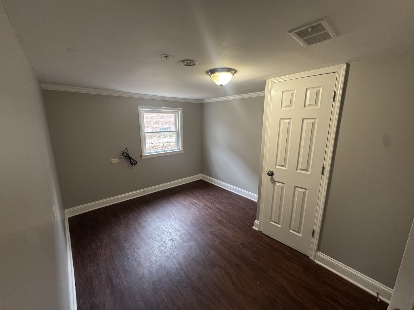 15125 East End Avenue Dolton, IL 60419 - Photo 18 of 21 an empty room with wooden floor and windows