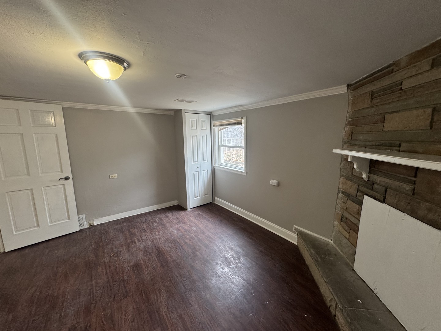 15125 East End Avenue Dolton, IL 60419 - Photo 19 of 21 an empty room with wooden floor and windows