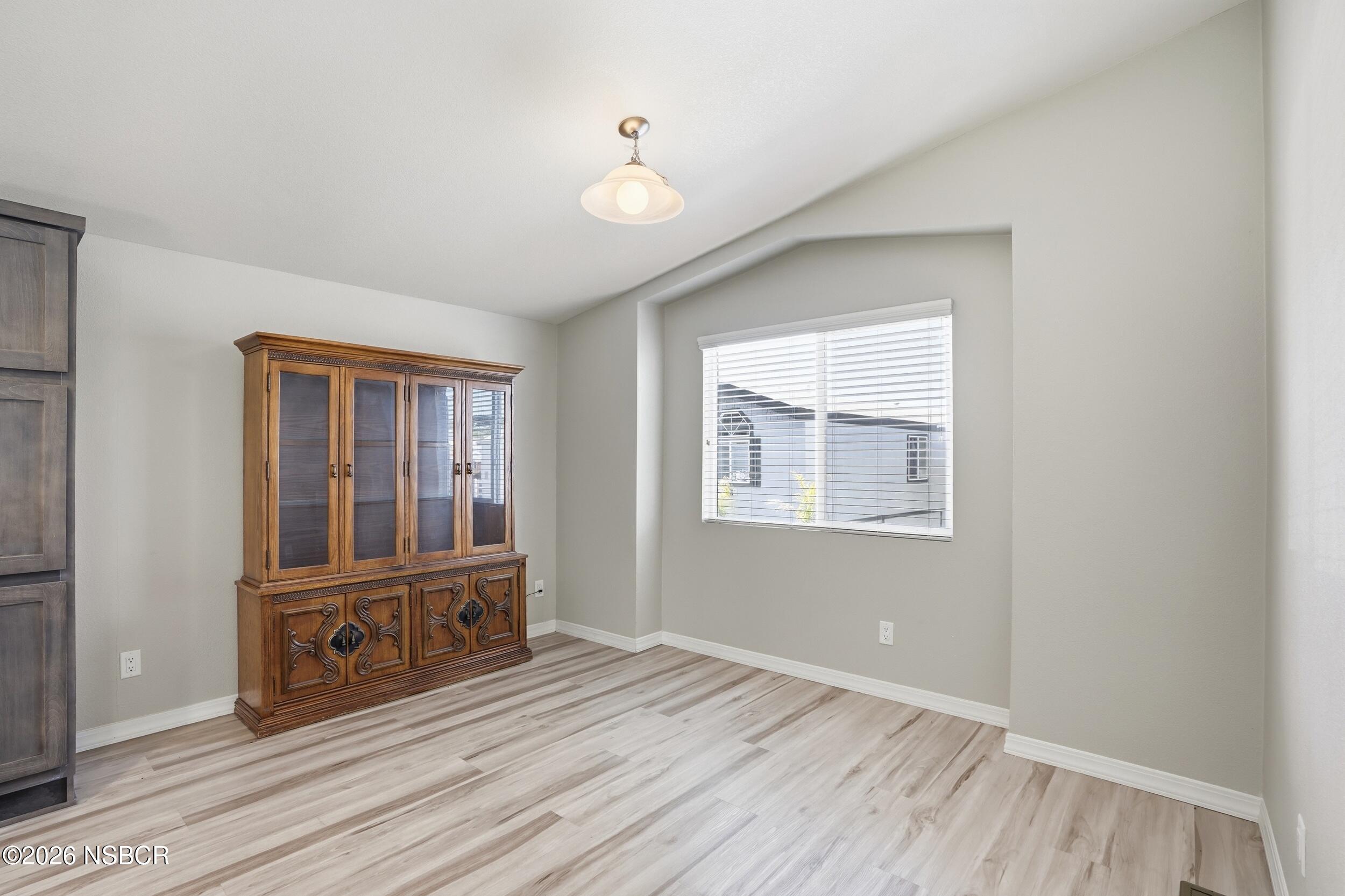 500 Atascadero Road, Unit M3 Morro Bay, CA 93442 - Photo 16 of 29 a view of an empty room with glass door and wooden floor