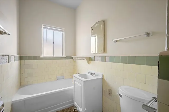 a bathroom with a sink a toilet and a bathtub
