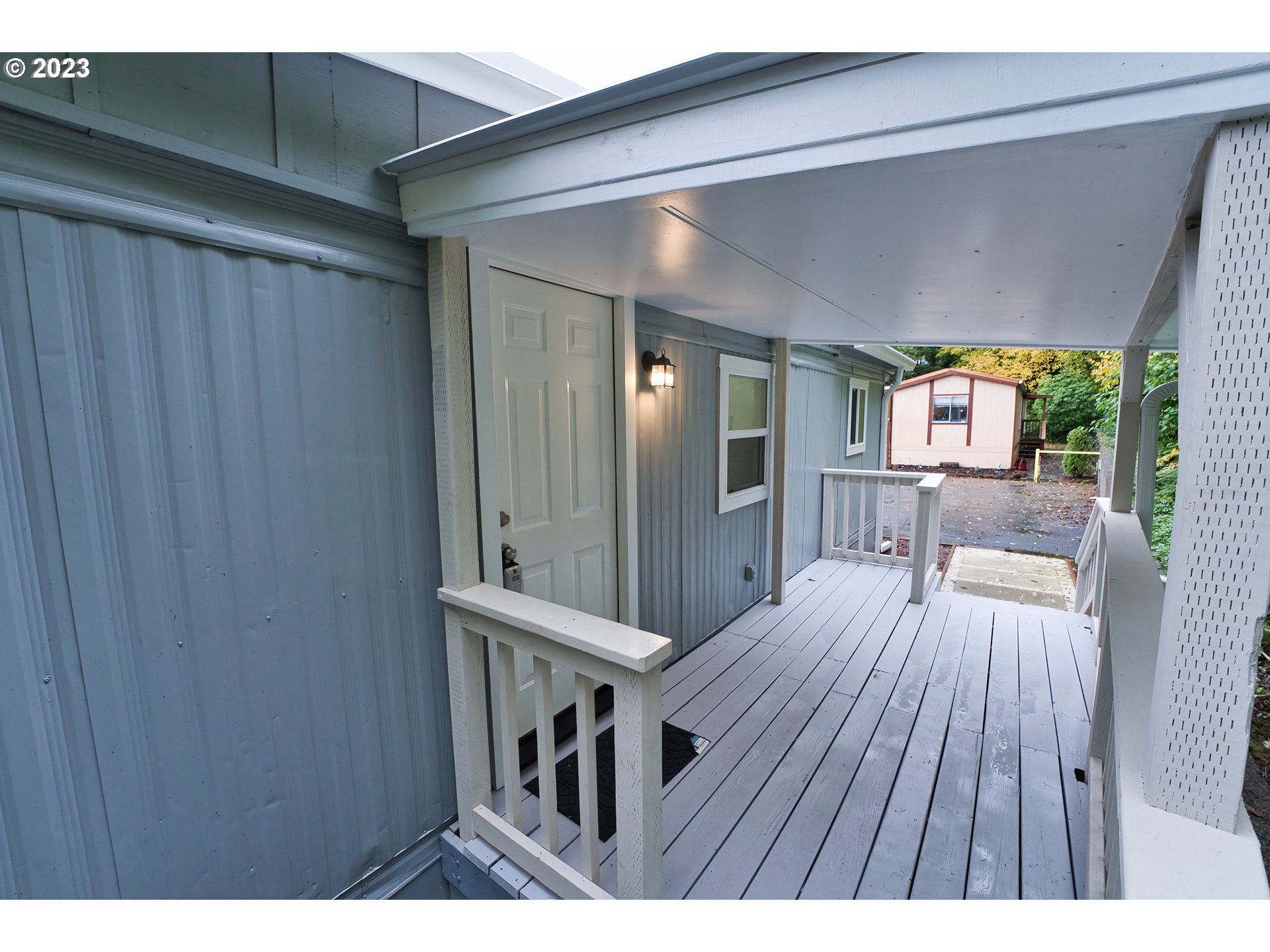 17655 Bluff Road, Unit 41 Sandy, OR 97055 - Photo 3 of 21 a view of a hallway with wooden floor and furniture