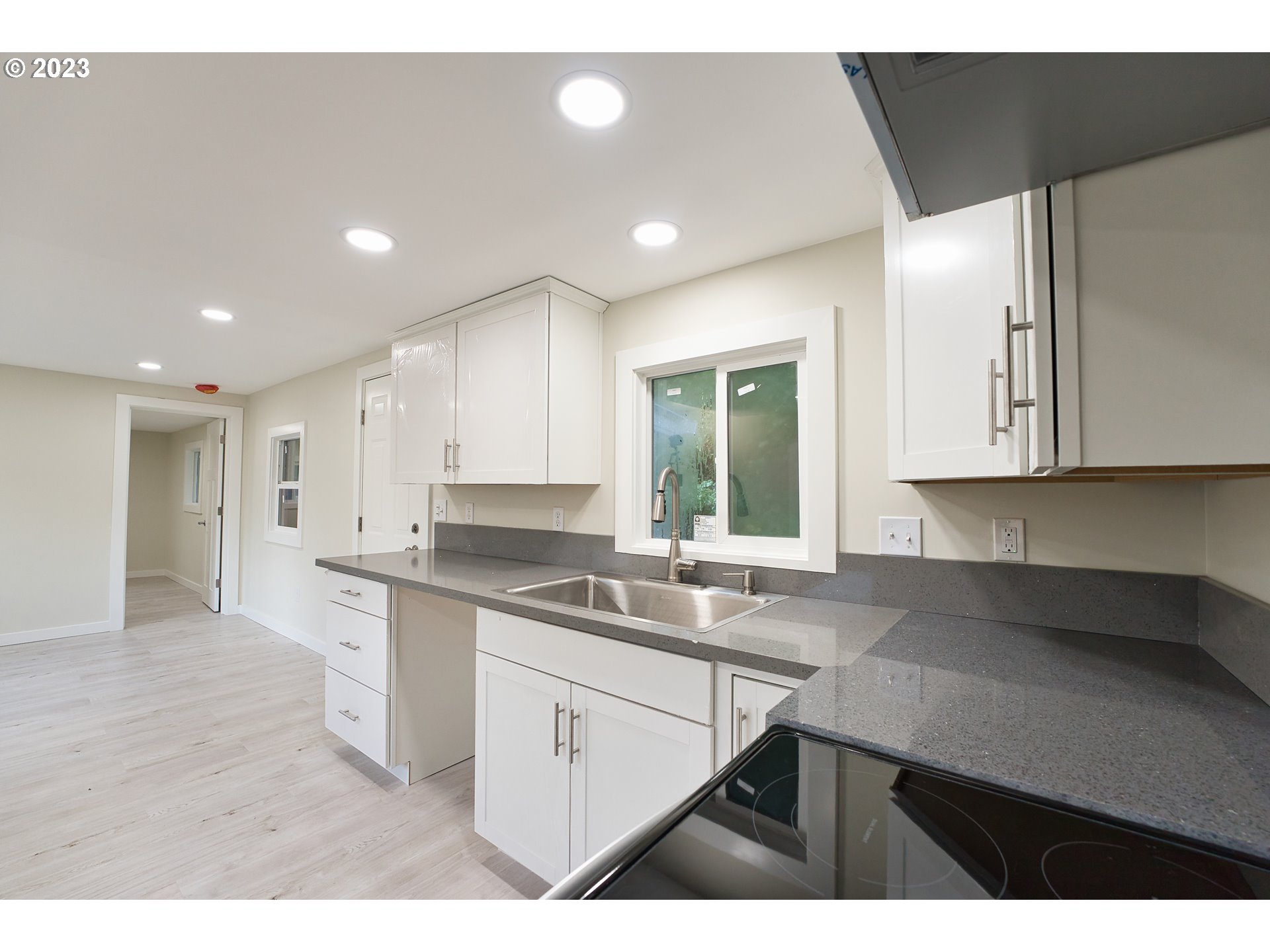 17655 Bluff Road, Unit 41 Sandy, OR 97055 - Photo 9 of 21 a kitchen with a sink stove and cabinets