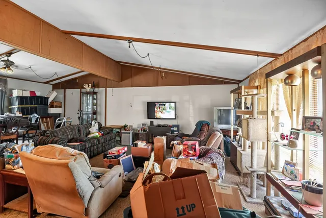 a living room with lots of furniture and a window