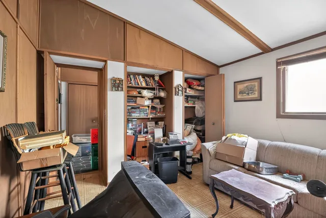 a living room with furniture a rug and a window