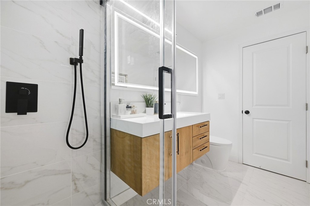 1280 East Woodbury Road Pasadena, CA 91104 - Photo 31 of 40 a bathroom with a sink vanity and tub