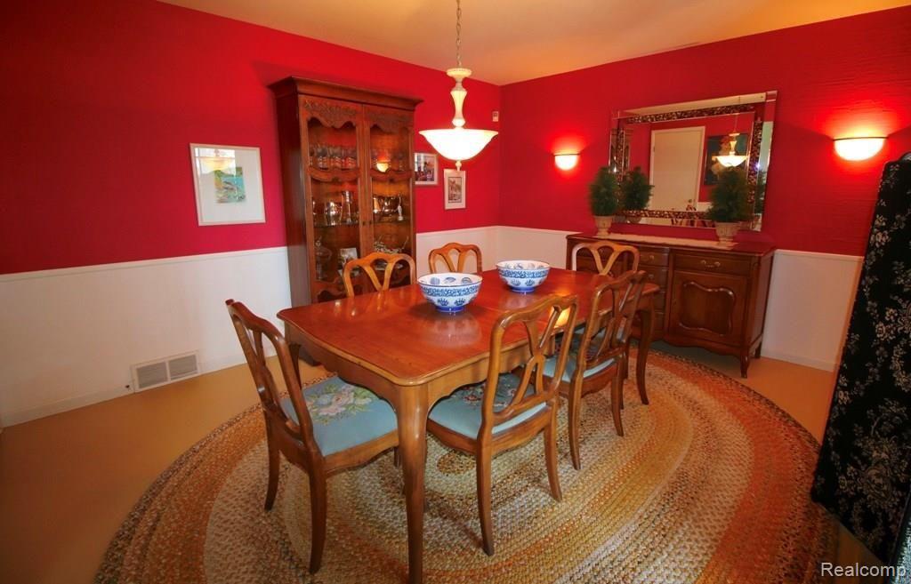 1080 West Highland Road Howell, MI 48843 - Photo 12 of 37 DINING ROOM WITH PAINTED FLOOR