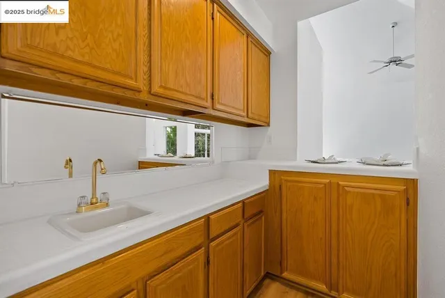 a kitchen with stainless steel appliances granite countertop a sink and cabinets