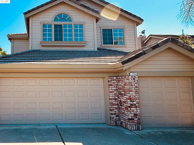 a view of a house with pool on the road