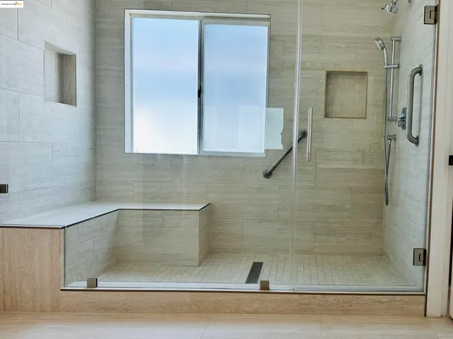 a view of a two chairs in the patio