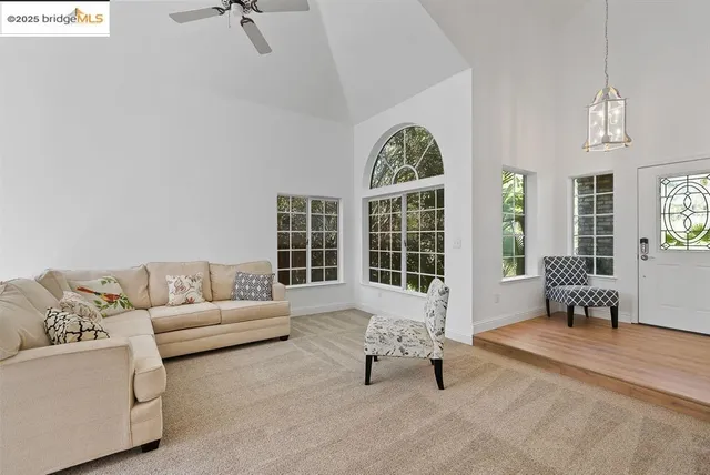 a living room with furniture and windows